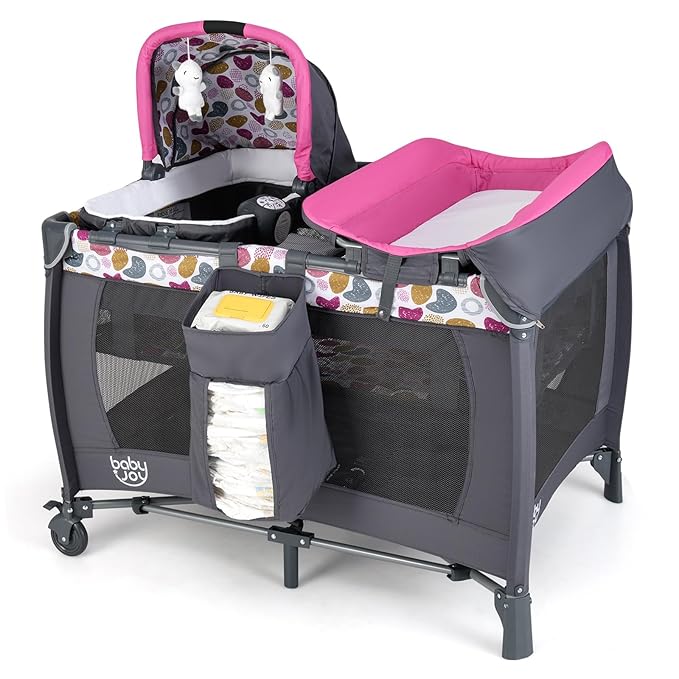 BABY JOY 5 in 1 Pink Pack and Play, Portable Baby Playard with Bassinet & Changing Table, Infant Pink Bassinet Nursery Center w/Toys & Music & Oxford Bag for Baby Girl Toddlers (Rose, Dot Circle)