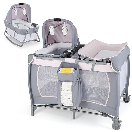 HONEY JOY Pack and Play with Bassinet, Infant Nursery Center Pack and Play w/Newborn Cradle & Hanging Toys, Diaper Storage, Music, Portable Baby Playard w/Changing Station (Starry Pink)