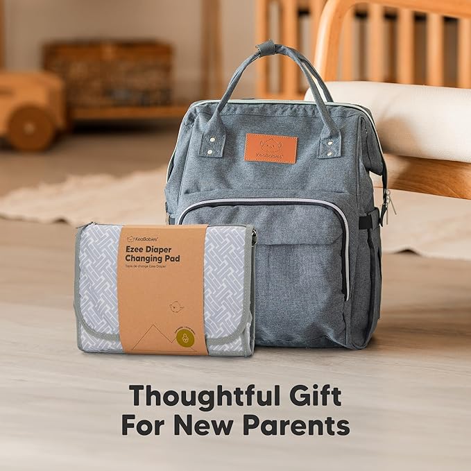 KeaBabies Portable Diaper Changing Pad - Large Waterproof Baby Changing Mat, Compact Travel Diaper Clutch, Functional Pockets Fit Newborn Essentials, Wipeable & Padded Baby Changer (Gray Mod)