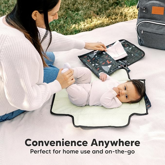 KeaBabies Portable Diaper Changing Pad - Large Waterproof Baby Changing Mat, Compact Travel Diaper Clutch, Functional Pockets Fit Newborn Essentials, Wipeable & Padded Baby Changer (Woods)